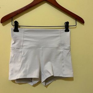 White fabletics spandex shorts with pockets